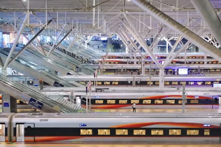 Modern China high speed rail train at a busy station platform
