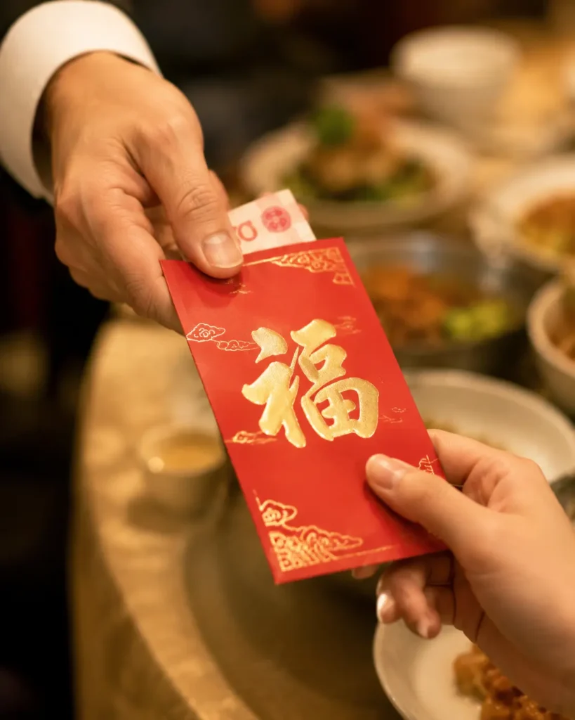 Chinese red envelope etiquette hongbao hands giving receiving wedding gift money