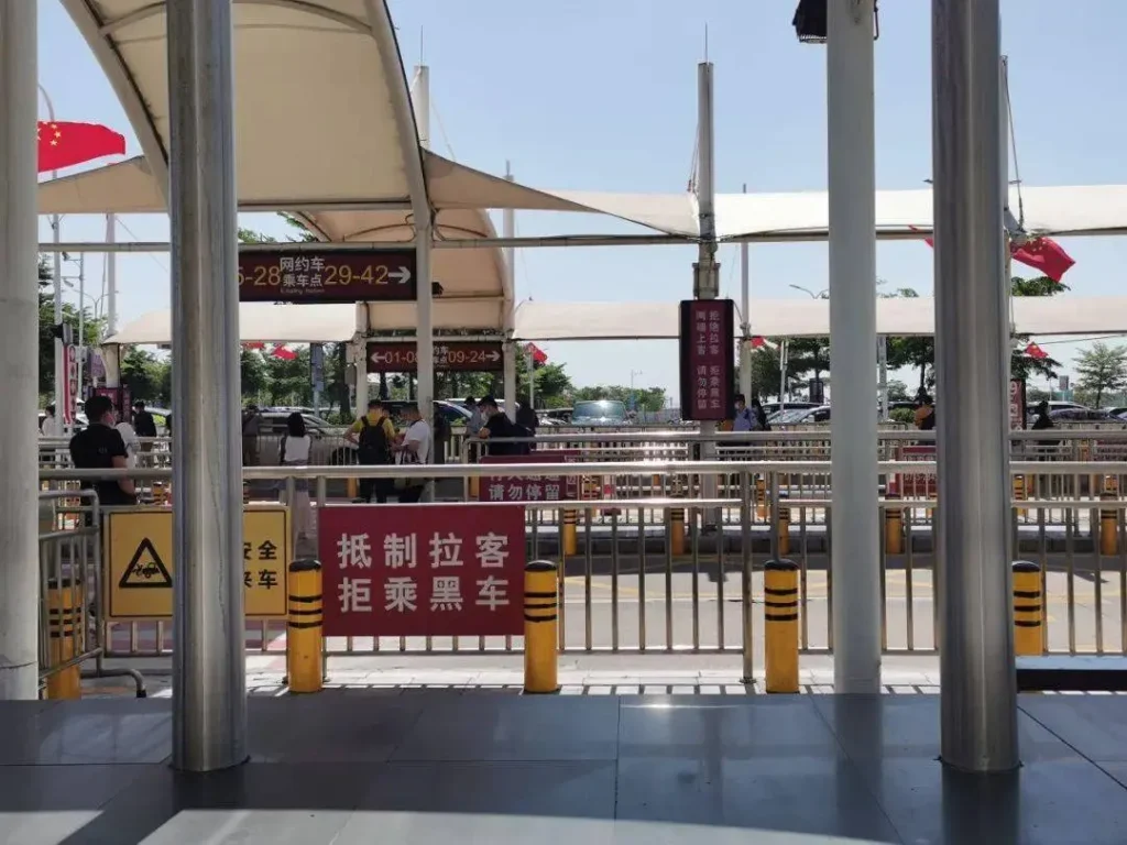 fake taxi china airport warning sign