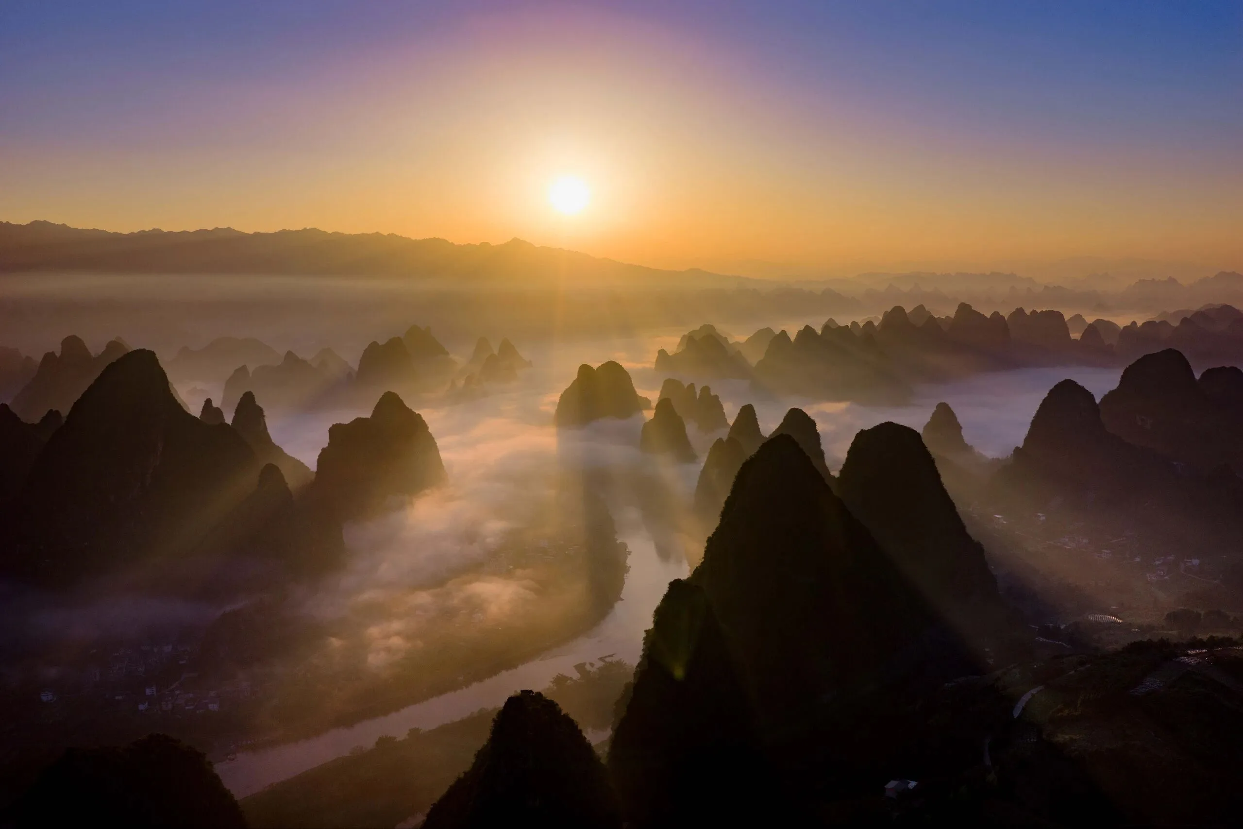 Xianggong Mountain sunrise over the Li River bend, Guilin